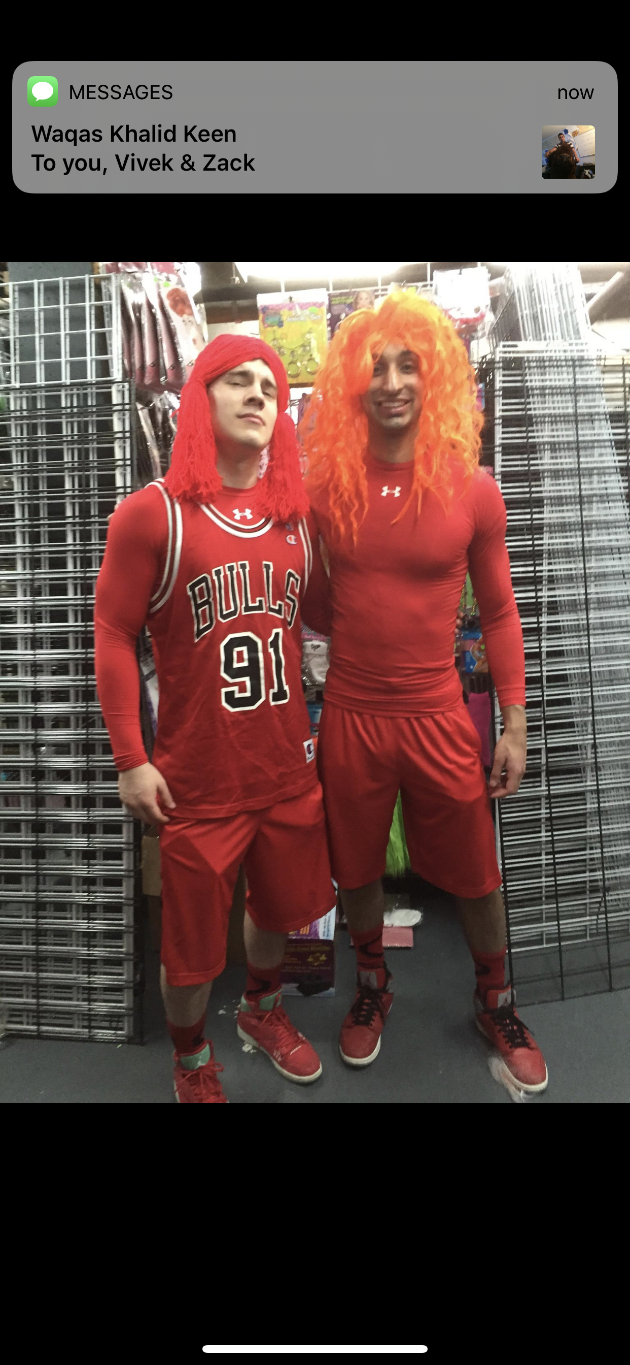 Vivek in a red-and-orange costume with a roommate on Halloween in New York, 2012