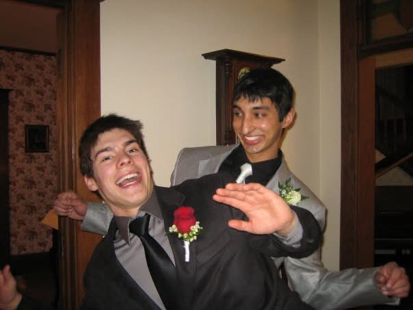 Vivek (right) and a friend in suits, laughing, dressed for a dance